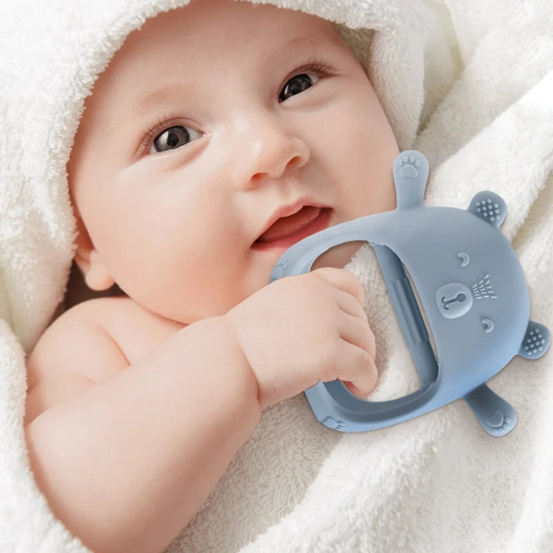 Baby Bubble BPA-free silicone baby teether glove for gum relief, showing soft textured surface and adjustable wrist strap.