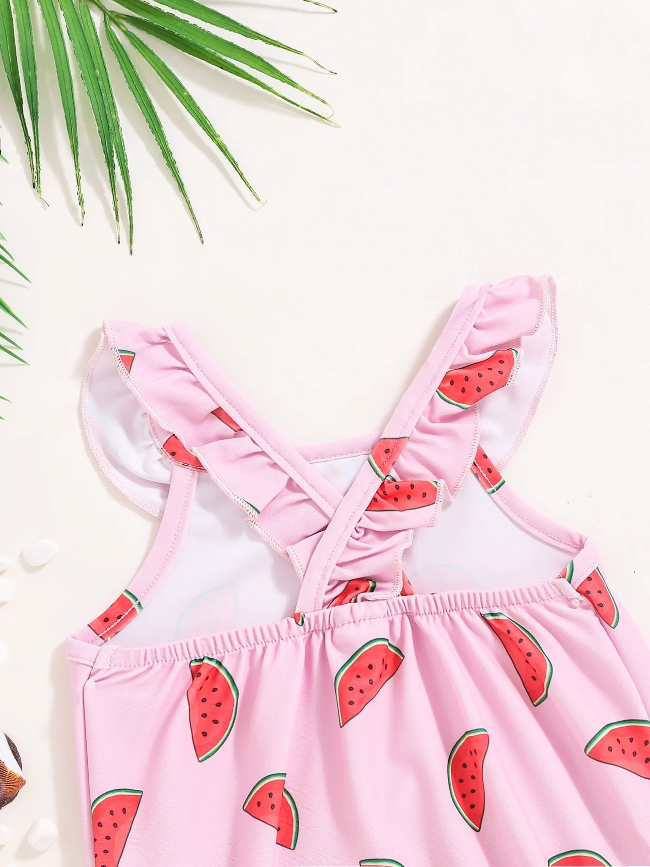 Baby Girl wearing a cute watermelon-themed one-piece swimsuit by Baby Bubble, perfect for sunny days and pool fun.