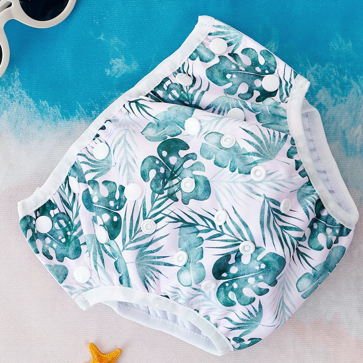 Reusable baby swim diapers by Baby Bubble featuring colorful animal prints, designed for comfortable and eco-friendly water play.