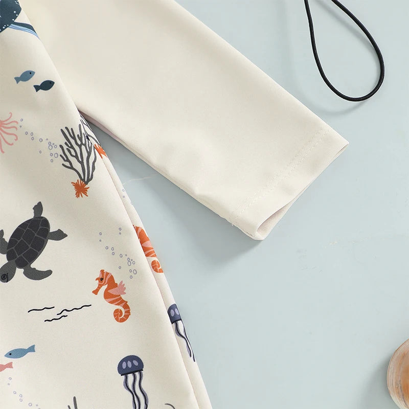 Baby boys rash guard set with marine animal print from Baby Bubble, featuring colorful aquatic-themed design and short sleeves.
