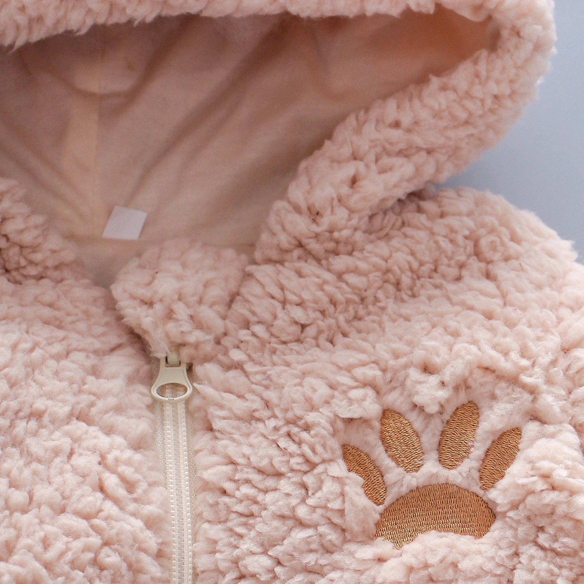 Soft fluffy lamb print baby romper from Baby Bubble, designed as a warm winter jumpsuit for infants.