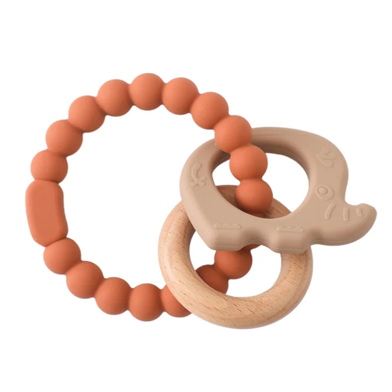 Baby Bubble BPA-free silicone baby teether glove with textured surface for soothing gums, shown on a baby’s hand.