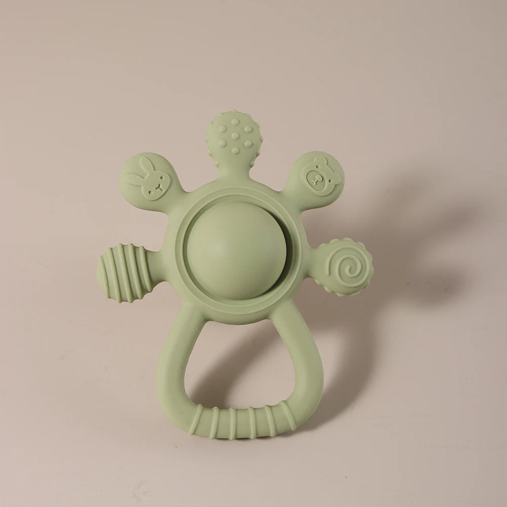 Baby Bunny Palm Rattle Teether by Baby Bubble, a soft plush baby bunny with a chew toy teether in its paws.