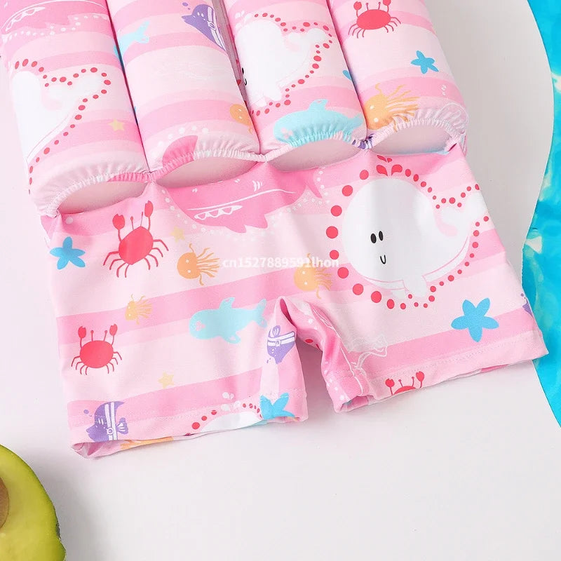 Children's buoyancy swimsuit by Baby Bubble featuring colorful cartoon print, designed for safe swimming and easy movement.