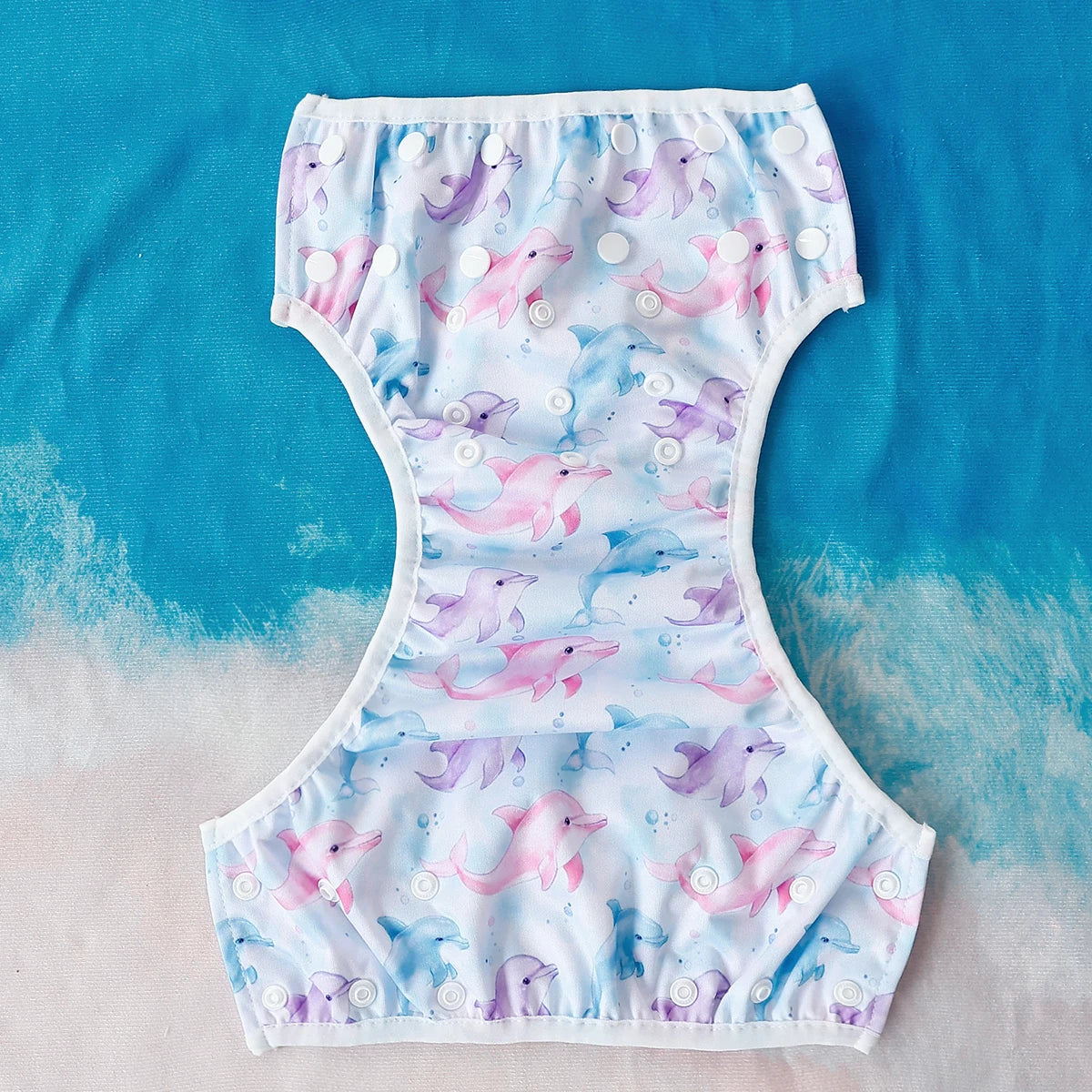 Baby Bubble washable baby swim diapers with adjustable fit, shown in a colorful design for comfortable swimming and water play.
