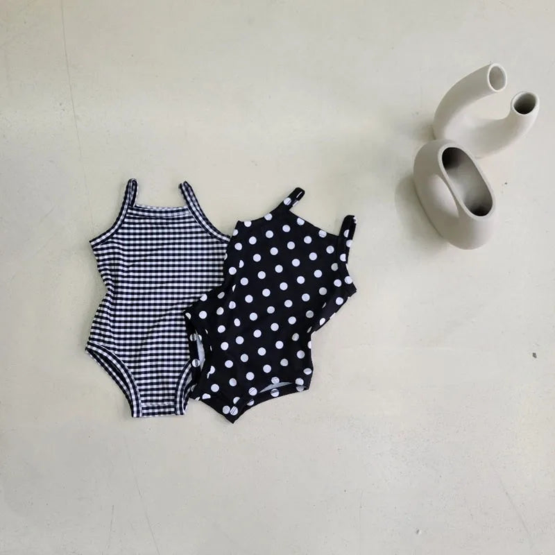 Baby Girl swimwear set by Baby Bubble with one-piece swimsuit and matching sun hat, lightweight and colorful for summer swimming.