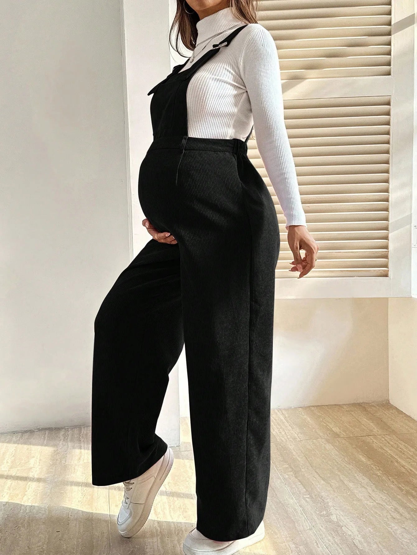 Baby Bubble maternity corduroy jumpsuit with suspenders, featuring comfortable, stylish maternity clothing for expectant mothers.