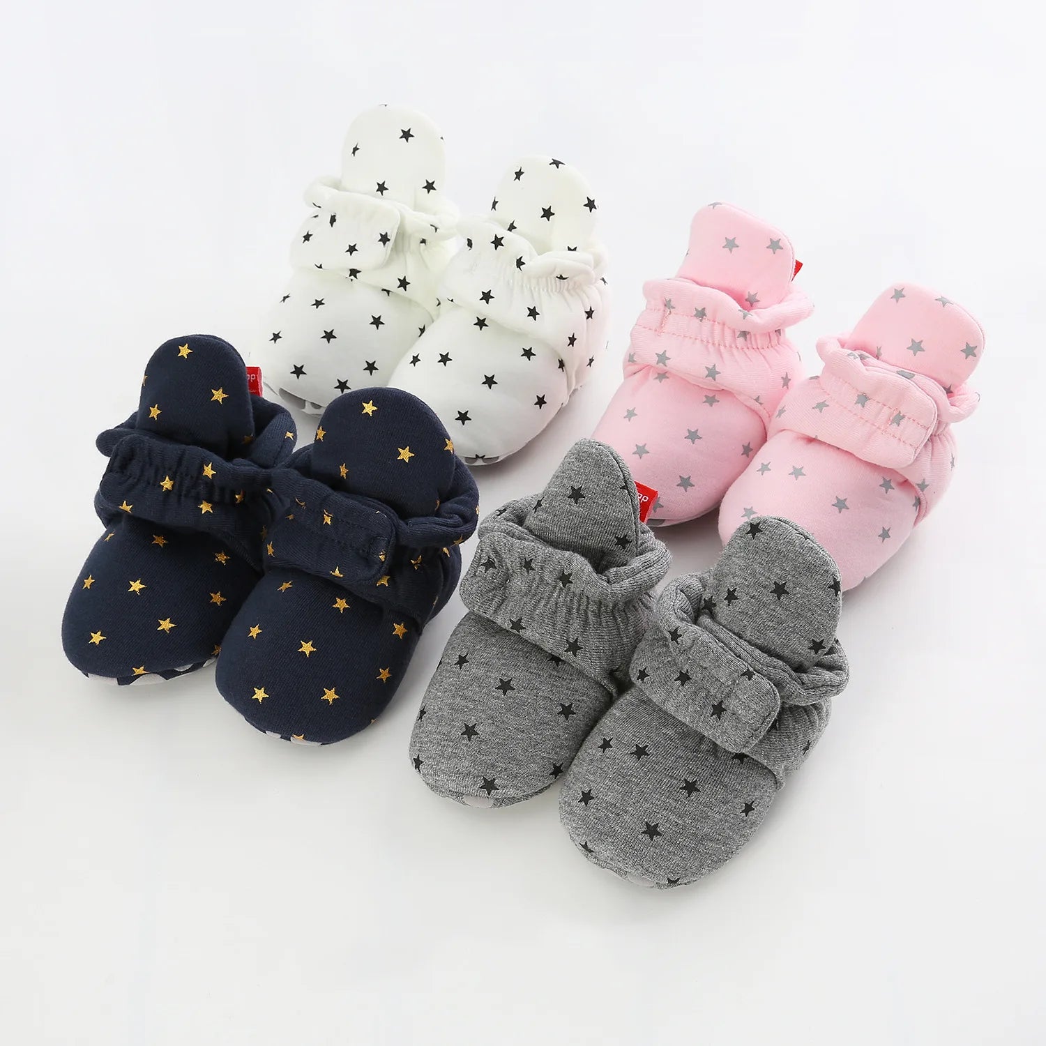 Baby Bubble first walker shoes for babies, soft anti-slip star booties with plush material and non-slip soles for toddler safety.