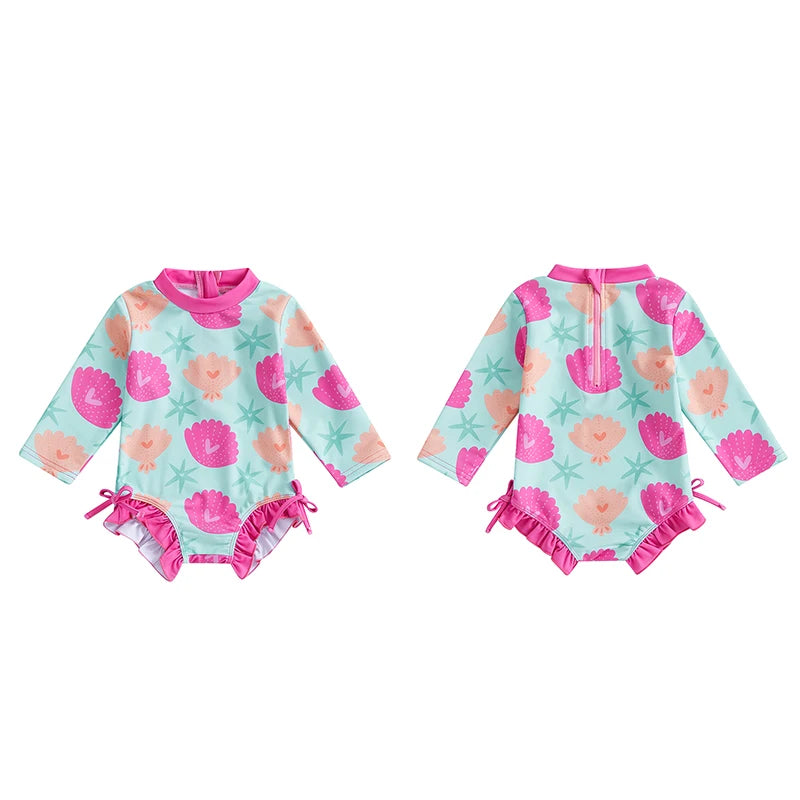 Baby girls rash guard swimsuit with shell print and UV protection, from Baby Bubble, featuring long sleeves and comfortable fit.