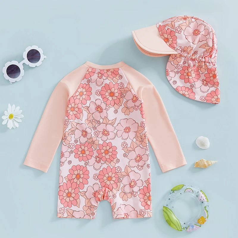 Baby Girls Rash Guard Set by Baby Bubble featuring floral and flamingo print, with long sleeves and matching swim bottoms.