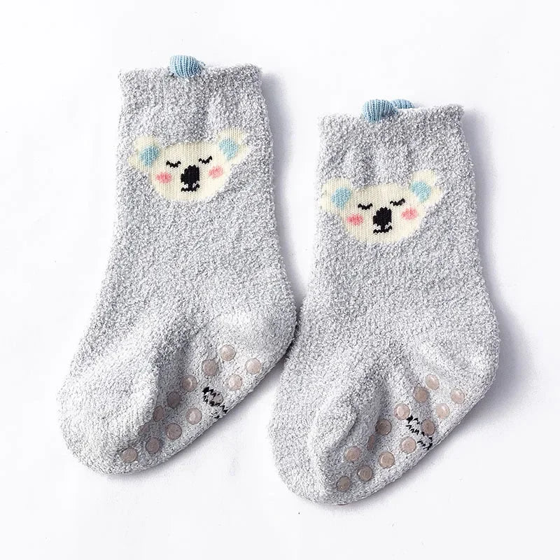 Baby Bubble baby dinosaur socks in soft, warm fabric featuring colorful dinosaur patterns on a white background.