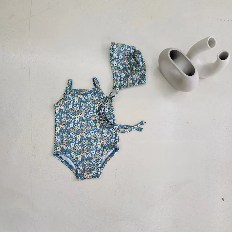 Baby girl swimwear set with one-piece suit and sun hat, Baby Bubble brand, perfect for summer beach or pool outings.