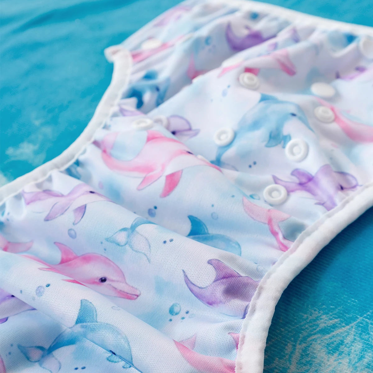 Baby Bubble washable and adjustable baby swim diapers laid flat, showing soft, waterproof fabric and secure fit for swimming.