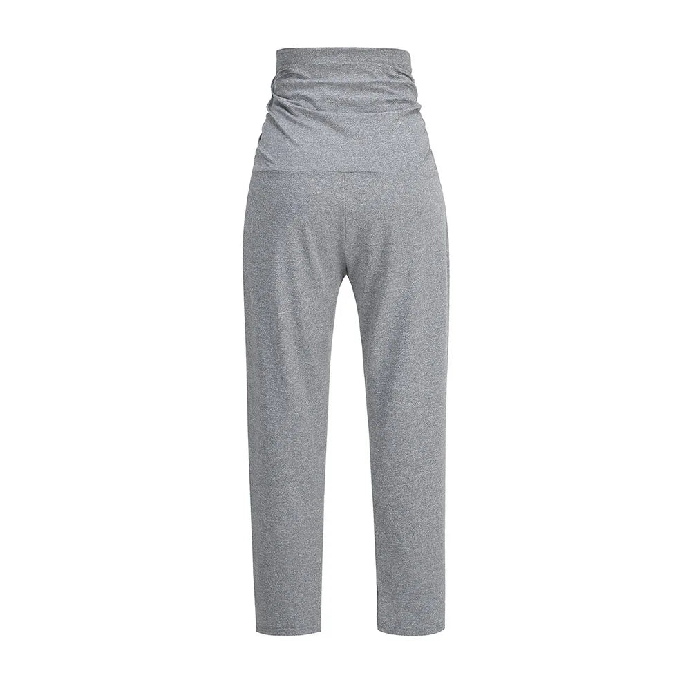 Pregnant woman wearing Baby Bubble maternity wide leg pants with over-belly support and comfortable, stylish fit.