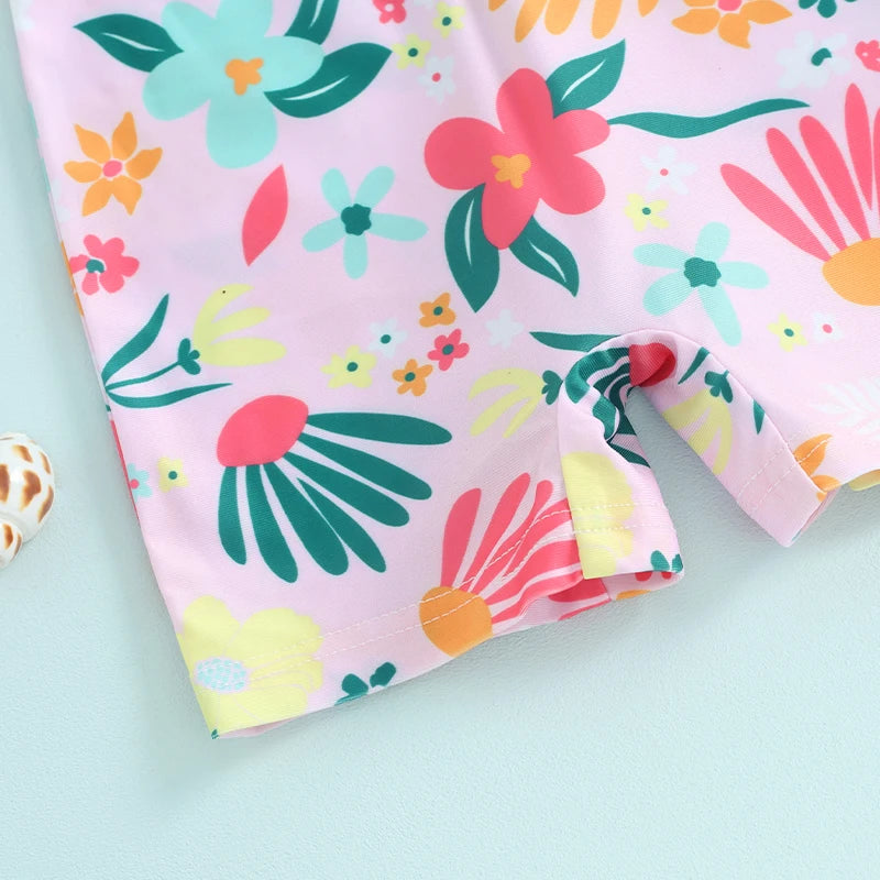 Baby Girl's floral rash guard romper with zipper from Baby Bubble, featuring colorful flower patterns and short sleeves.
