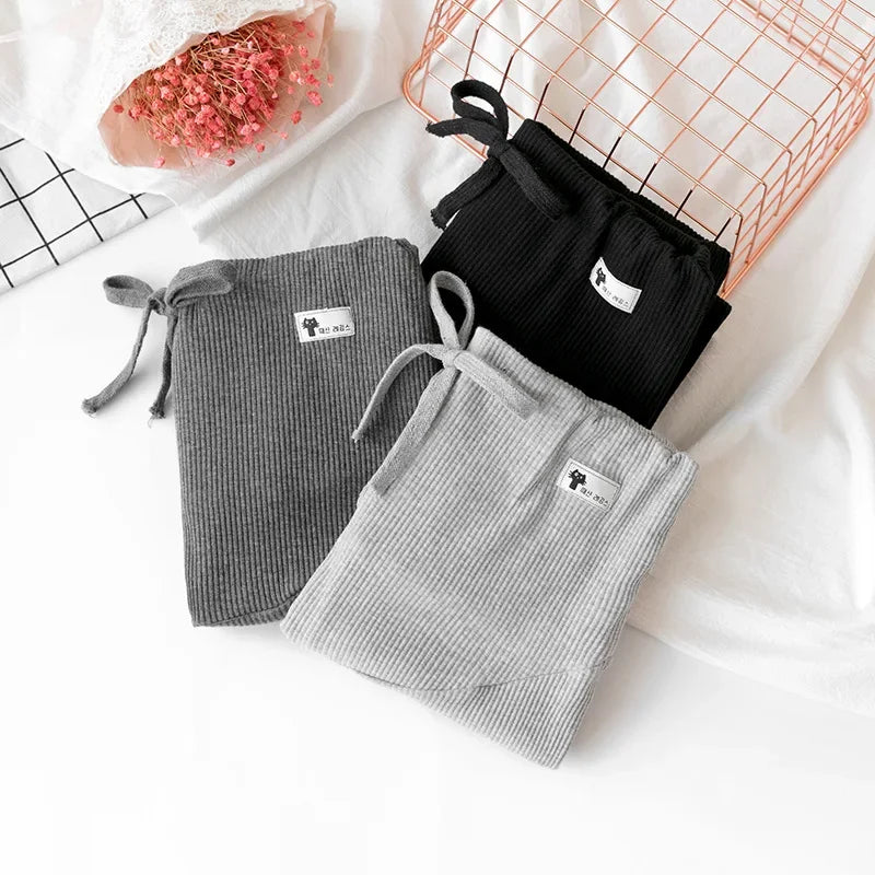 Adjustable maternity pants by Baby Bubble with soft, high waist design, offering comfortable, flexible fit for pregnancy.