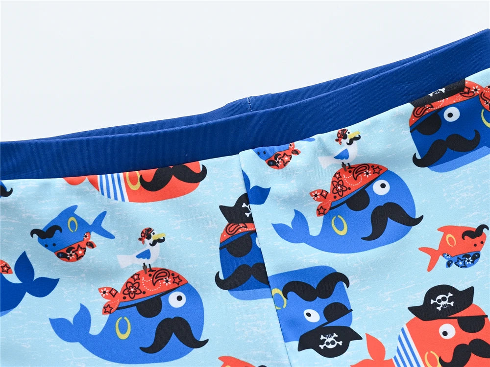 Boy wearing a Baby Bubble boys' 2-piece swimsuit set with a colorful cool print, suitable for ages 1 to 7 years.