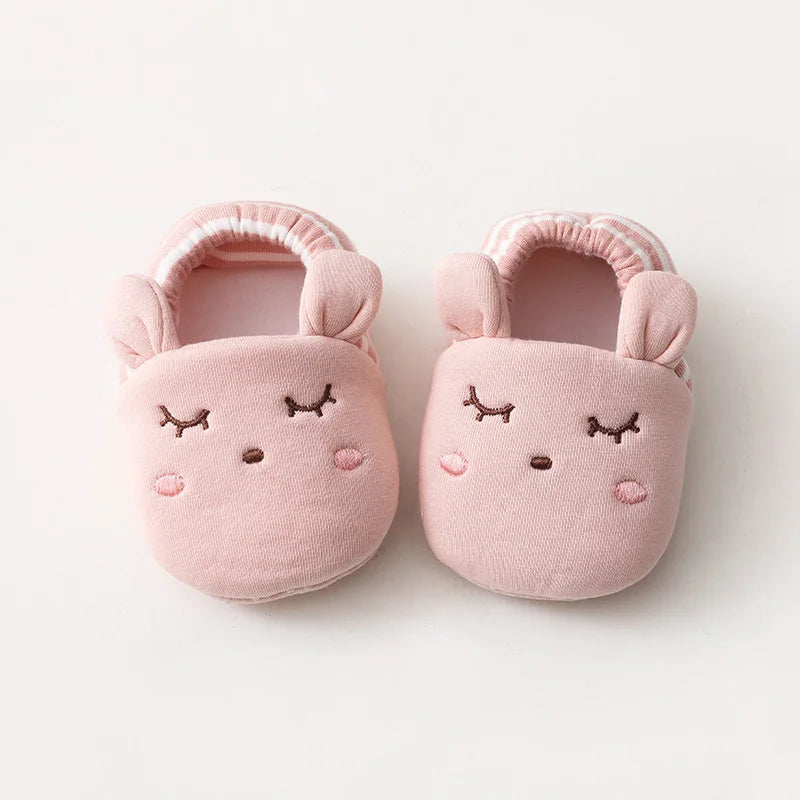 Baby Bubble First Walker Crib Shoes with soft anti-slip soles, designed for infants learning to walk, in a cute sneaker style.