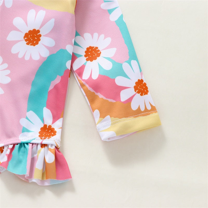 Baby Bubble baby girl UV swimsuit with long sleeves, zipper, and matching sun hat, perfect for sun protection at the beach or pool.