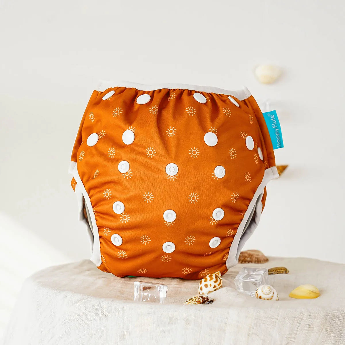 Baby Bubble reusable baby swim diapers with colorful animal print design, suitable for water activities and gentle on sensitive skin.