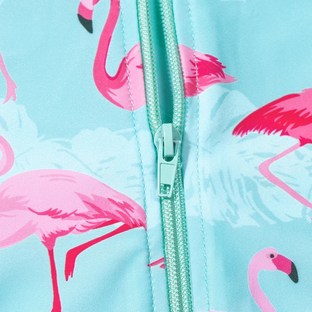 Girls Flamingo UV long sleeve one-piece swimsuit by Baby Bubble featuring a pink flamingo pattern and bright summer colors.