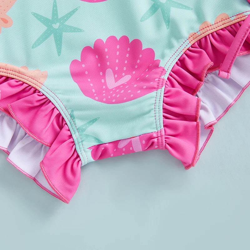 Baby Girl's Shell Print UV Rash Guard Swimsuit by Baby Bubble, featuring long sleeves and vibrant seashell pattern for sun protection.