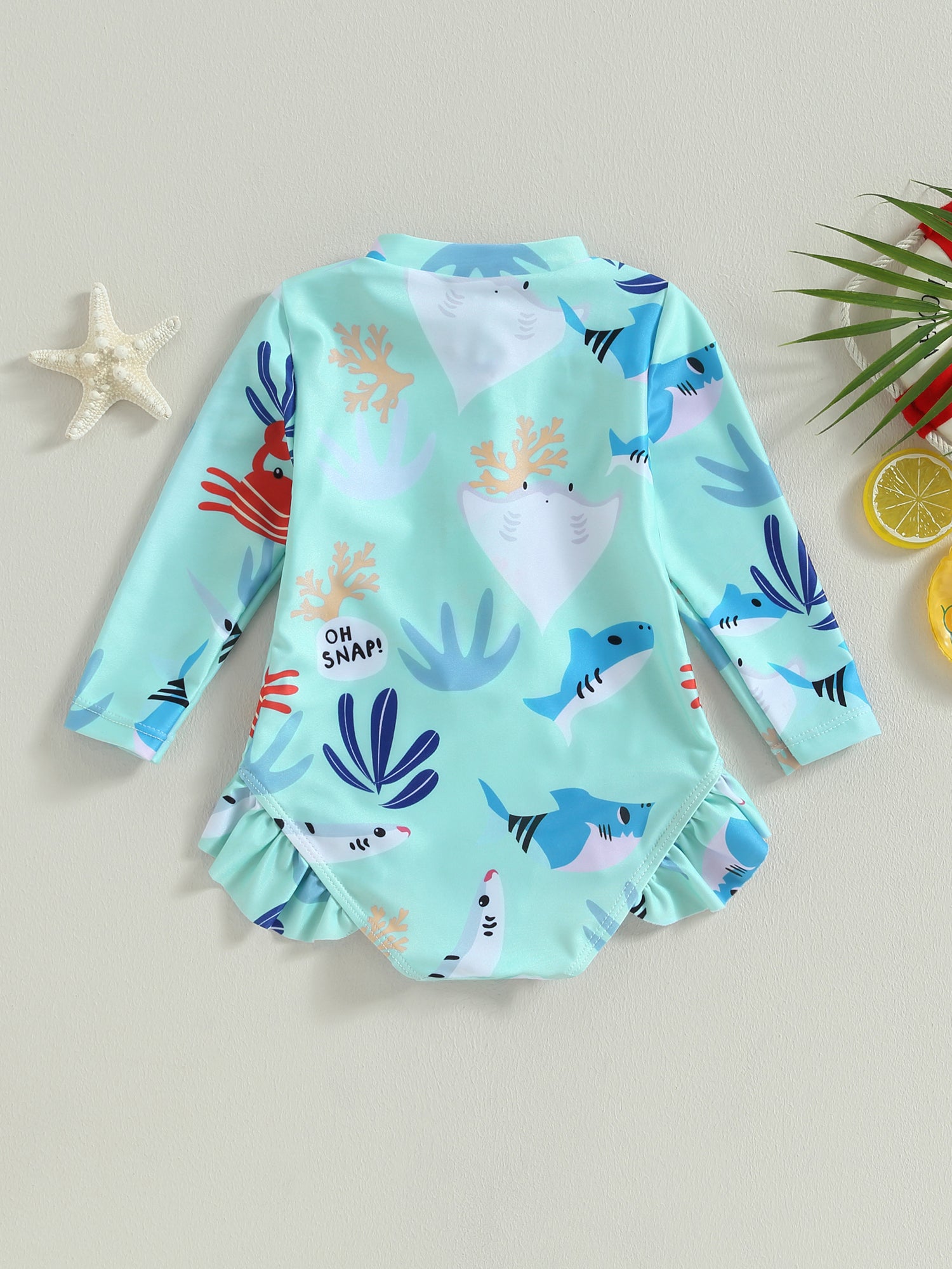 Girls long sleeve swimsuit with sea animal print from Baby Bubble, featuring colorful aquatic designs for kids' swimming attire.