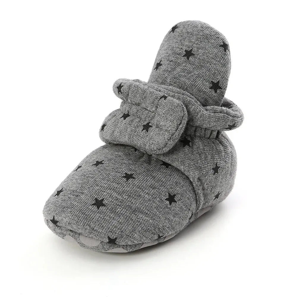 Baby Bubble baby first walker shoes with soft anti-slip star booties, featuring colorful star designs on small toddler footwear.