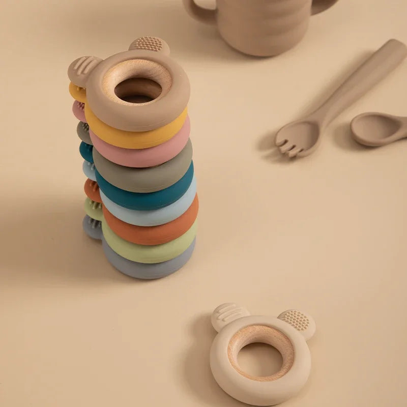 Baby Bubble silicone wood teether ring, a safe soothing chew toy for babies with natural wood and soft silicone textures.