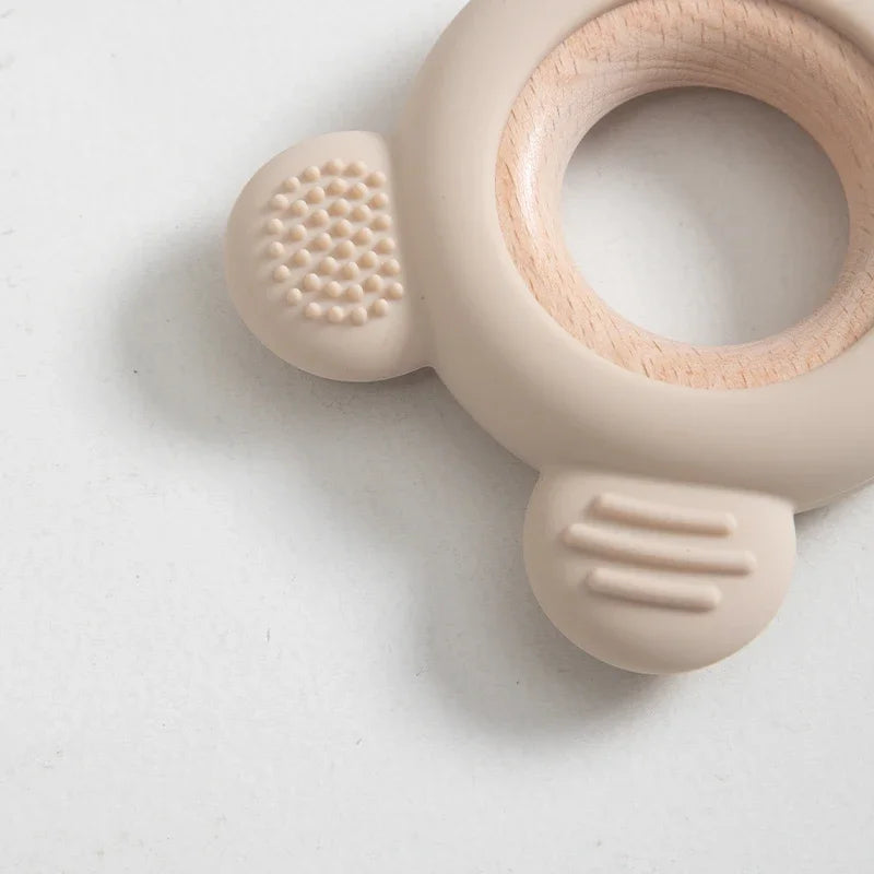 Baby Bubble silicone wood teether ring with soft, safe chew surface for soothing and calming babies.