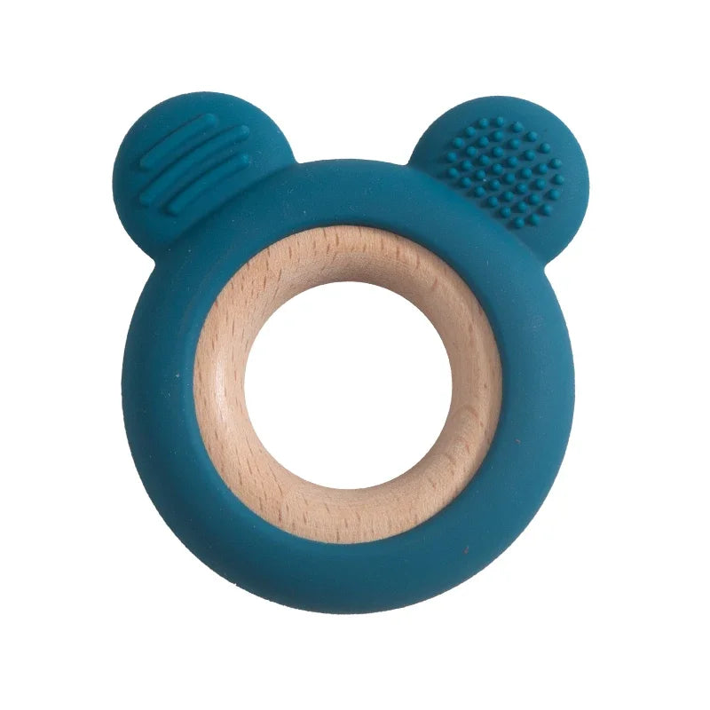Baby Bubble silicone wood teether ring with smooth edges and natural wood accents, designed for soothing baby chewing comfort.