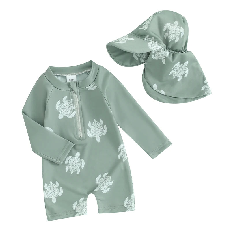 Baby boys rash guard set with turtle and dinosaur print by Baby Bubble, featuring short sleeves and vibrant aquatic and prehistoric designs.
